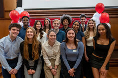 A group of students pose for a photo at a Cox Scholars event.